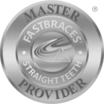 Silver badge logo for Fastbraces Master Provider, featuring the words 'Fastbraces Straight Teeth' in the center with a stylized triangle and smile, surrounded by 'Master Provider' text.